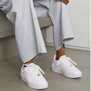 New, never worn, Nike AF1 sneakers with stacked soles.